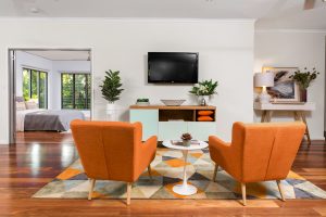 modern designed living area with two orange chairs